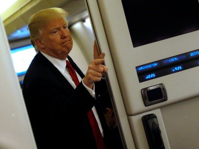 u s president donald trump speaks to reporters aboard air force one as they approach joint base andrews maryland u s march 15 2017 photo reuters