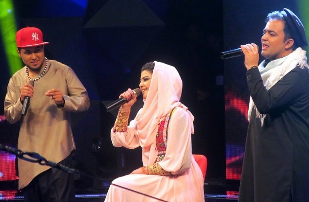 young afghan singer zulala hashemi performs alongside competitors sayed jamal mubarez l and babak mohammadi during the television music competition 039 afghan star 039 in kabul photo afp