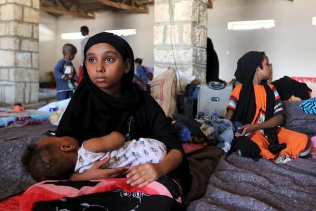 a yemeni girl holds a baby in a temporary shelter after fleeing violence in yemen at the port town bosasso in somalia 039 s puntland photo reuters a yemeni girl holds a baby in a temporary shelter after fleeing violence in yemen at the port town bosasso in somalia 039 s puntland photo reuters