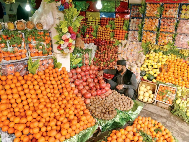 a fruit shop vendor in the sikander town area of peshawar photo muhammad iqbal express a fruit shop vendor in the sikander town area of peshawar photo muhammad iqbal express