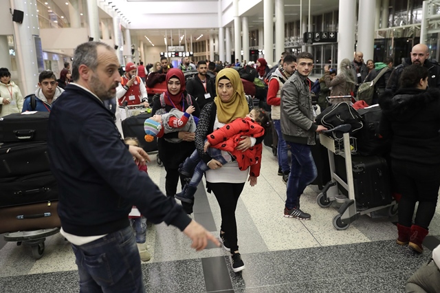 syrian refugees who were granted humanitarian visas by the italian government head to the departures hall in beirut 039 s international airport on march 1 2017 ahead of their flight to rome photo afp