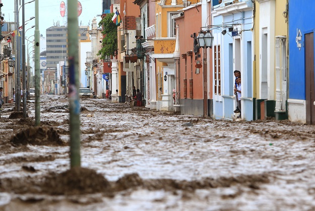 a flash flood hits the colorful historic centre of the city of trujillo 570 kilometres north of lima on march 18 2017 bringing mud and debris photo afp