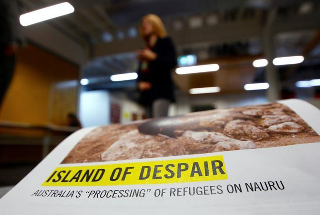 anna neistat senior director for research with amnesty international talks to journalists behind a copy of a report she co authored titled 039 island of despair   australia 039 s 039 039 processing 039 039 of refugees on nauru 039 in sydney australia october 17 2016 photo reuters