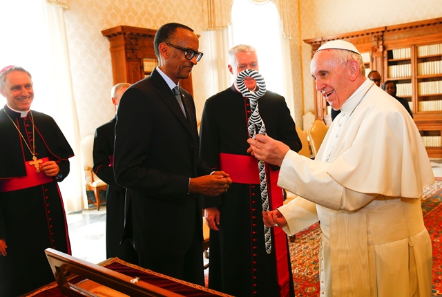 pope francis r receives a present from rwanda 039 s president paul kagame ahead of a meeting at the vatican march 20 2017 photo afp