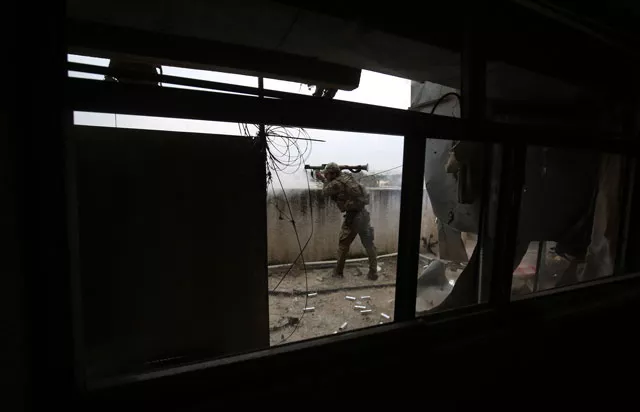 a member of the iraqi forces consisting of the iraqi federal police and the elite rapid response division fires a rocket propelled grenade towards islamic state is group jihadists as they advance in the old city in western mosul on march 19 2017 during the offensive to retake the city from is group fighters photo afp a member of the iraqi forces consisting of the iraqi federal police and the elite rapid response division fires a rocket propelled grenade towards islamic state is group jihadists as they advance in the old city in western mosul on march 19 2017 during the offensive to retake the city from is group fighters photo afp