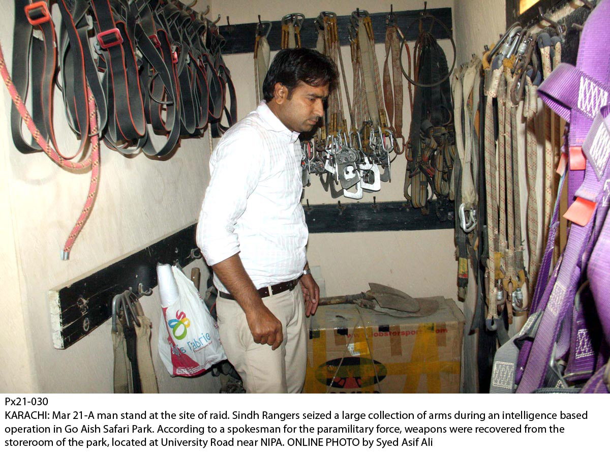 a man stands at the site of the raid at go aish adventure park on university road photo online