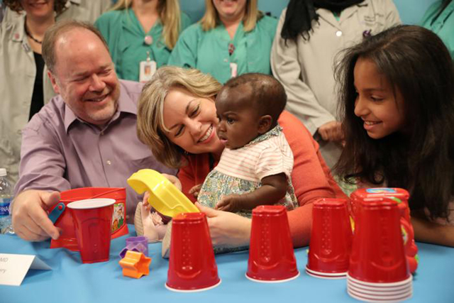 host family members nancy swabb her husband tim swabb and their daughter mara swabb 9 play with 039 baby dominique 039 during a news conference where doctors and staff discuss the outcome of a complex surgical procedure to treat the 10 month old who was born with four legs and two spines at advocate children 039 s hospital in park ridge illinois us march 21 2017 photo reuters