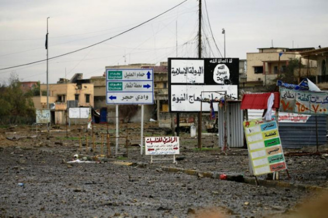 islamic state signs are seen on a street during a battle between iraqi forces and islamic state militants in mosul iraq march 16 2017 photo reuters islamic state signs are seen on a street during a battle between iraqi forces and islamic state militants in mosul iraq march 16 2017 photo reuters