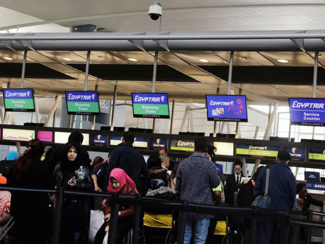 travellers wait to check in at an egypt air counter at jfk international airport in new york us march 21 2017 photo reuters travellers wait to check in at an egypt air counter at jfk international airport in new york us march 21 2017 photo reuters
