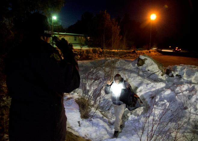 a man who claimed to be from sudan who kept saying quot i just want to be safe quot is confronted by a royal canadian mounted police rcmp officer as he illegally crosses the us canada border leading into hemmingford quebec canada march 20 2017 photo reuters