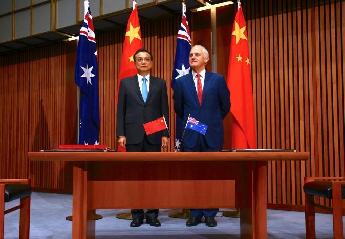 australia 039 s prime minister malcolm turnbull stands with chinese premier li keqiang before the start of an official signing ceremony at parliament house in canberra australia march 24 2017 photo reuters