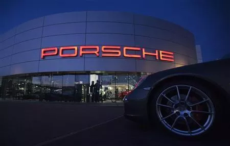 an illuminated porsche logo is pictured on a building of a porsche retail centre in niederwangen photo reuters an illuminated porsche logo is pictured on a building of a porsche retail centre in niederwangen photo reuters