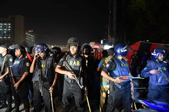 bangladesh police stand guard after an attacker was killed in front of a police box at the entrance to dhaka s international airport on march 24 2017 photo afp bangladesh police stand guard after an attacker was killed in front of a police box at the entrance to dhaka s international airport on march 24 2017 photo afp
