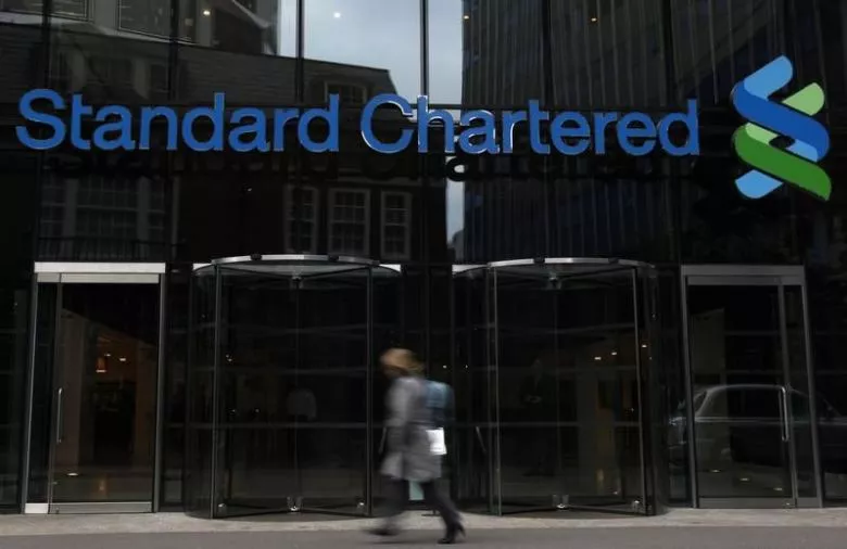 a woman walks past a standard chartered bank in london october 13 2010 photo reuters a woman walks past a standard chartered bank in london october 13 2010 photo reuters