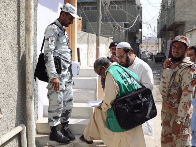 an enumerator collects data in karachi as part of the sixth population census conducted in 2017 photo online file an enumerator collects data in karachi as part of the sixth population census conducted in 2017 photo online file
