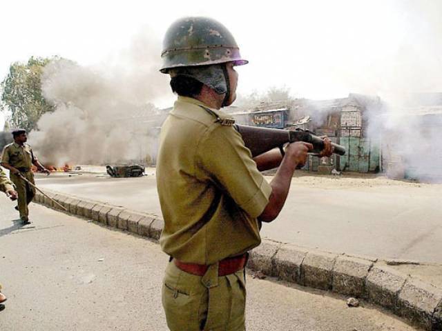 riot police fire tear gas to disperse a hindu mob that attacked a mosque in ahmedabad in gujarat on february 28 2002 photo afp