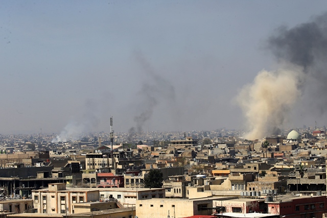 smoke rises from the old city during a battle against islamic state militants in mosul iraq march 26 2017 photo reuters