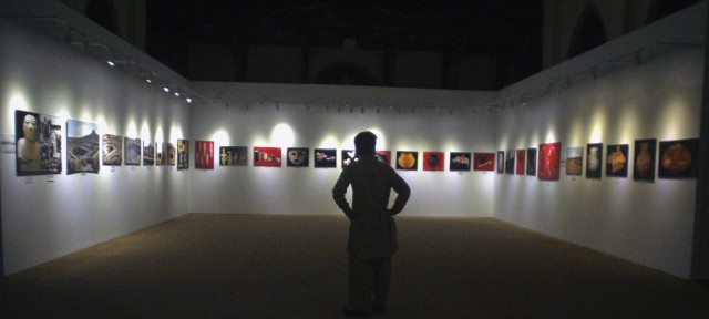 a visitor at the first day of the three day photo exhibition of 90 heritage sites takes a journey through an exceptional mosaic of culture and history photo athar khan express a visitor at the first day of the three day photo exhibition of 90 heritage sites takes a journey through an exceptional mosaic of culture and history photo athar khan express