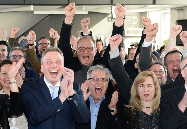 supporters of the christian democratic union cdu react after exit poll results of the state election in saarland were announced on public tv at an election event in saarbrucken south western germany on march 26 2017 photo afp