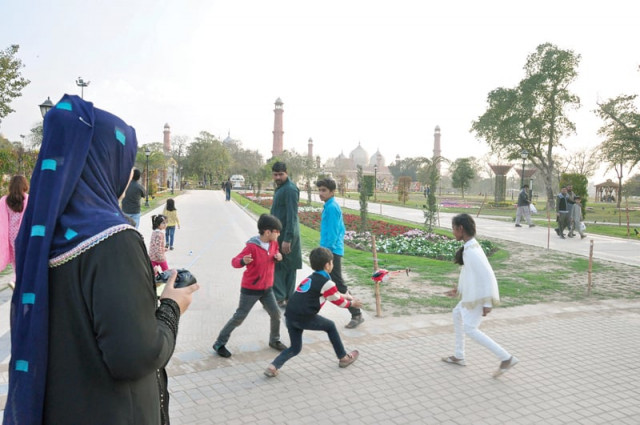 children play with a remote controlled helicopter at iqbal park pha has made it mandatory for everyone to show their identity card at parks photo abid nawaz express children play with a remote controlled helicopter at iqbal park pha has made it mandatory for everyone to show their identity card at parks photo abid nawaz express
