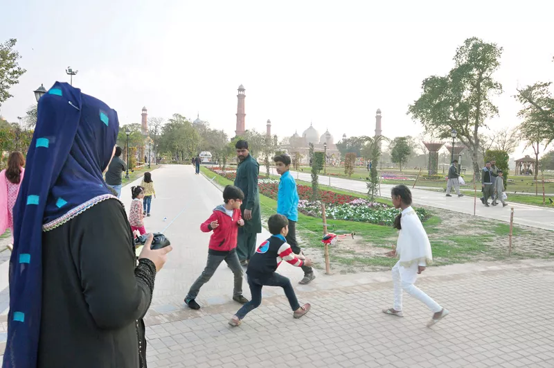 children play with a remote controlled helicopter at iqbal park pha has made it mandatory for everyone to show their identity card at parks photo abid nawaz express children play with a remote controlled helicopter at iqbal park pha has made it mandatory for everyone to show their identity card at parks photo abid nawaz express