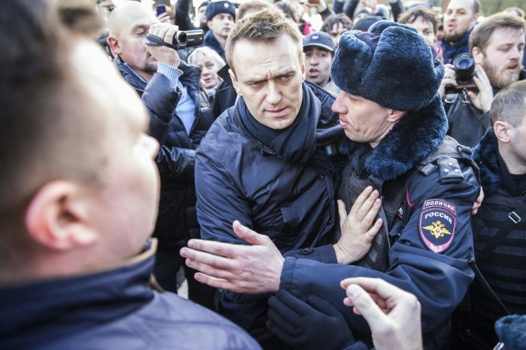 police detain kremlin critic alexei navalny during an unauthorised anti corruption rally in central moscow on march 26 2017 photo afp