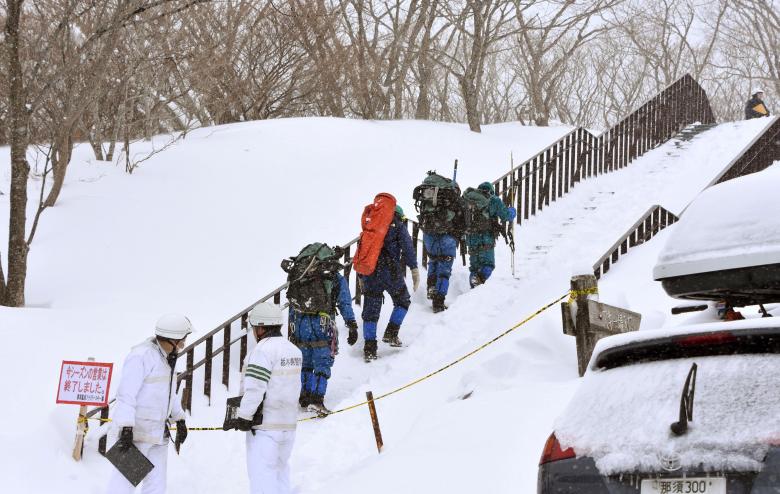 rescue workers climb toward a mountain for searching missing people after an avalanche near a ski resort in nasu town north of tokyo japan in this photo taken by kyodo march 27 2017 photo reuters