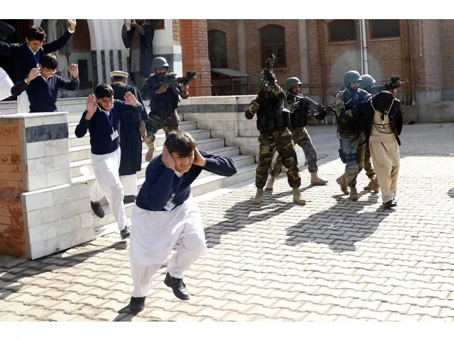 school children flee as soldiers conducting an exercise to repel militant attacks detain a mock militant r at the islamia collegiate school in peshawar pakistan february 2016 photo reuters school children flee as soldiers conducting an exercise to repel militant attacks detain a mock militant r at the islamia collegiate school in peshawar pakistan february 2016 photo reuters