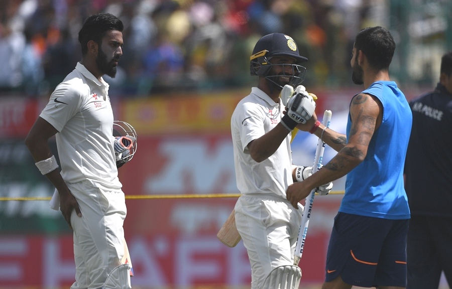 india 039 s virat kohli r congratulates ajinkya rahane c and lokesh rahul l after the victory during the fourth day of the fourth and final cricket test match between india and australia at the himachal pradesh cricket association stadium in dharamsala on march 28 2017 photo afp