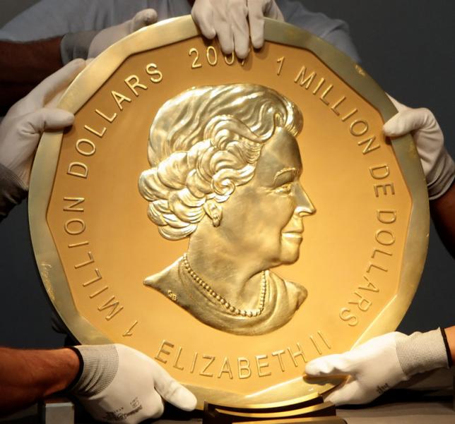 picture taken in vienna austria on june 25 2010 shows experts of an austrian art forwarding company holding one of the world 039 s largest gold coins a 2007 canadian 1 000 000 quot big maple leaf quot an identical coin was stolen from berlin 039 s bode museum on march 27 2017 photo reuters