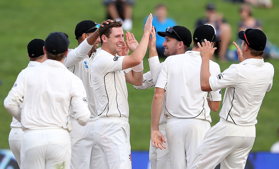 matt henry c of new zealand celebrates with teammates after taking the wicket of temba bavuma of south africa during day four of the third test cricket match between new zealand and south africa at seddon park in hamilton on march 28 2017 photo afp