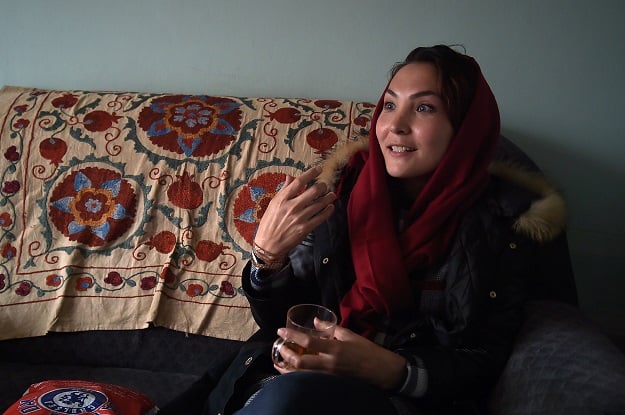 in this photograph taken on march 18 2017 afghan swimmer and coach elena saboori 25 head of the newly created women 039 s swimming committee gestures as she speaks during an interview with afp in a house in kabul photo afp