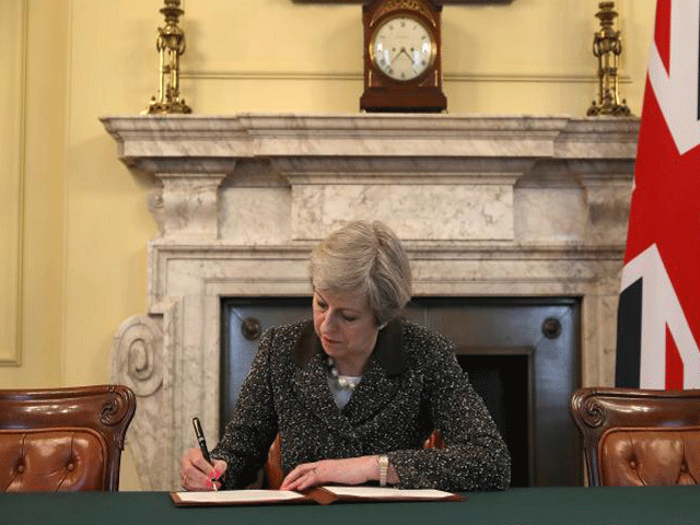 british pm theresa may in the cabinet office signs the official letter to european council president donald tusk invoking article 50 and the uk 039 s intention to leave the eu on march 28 2017 in london photo reuters british pm theresa may in the cabinet office signs the official letter to european council president donald tusk invoking article 50 and the uk 039 s intention to leave the eu on march 28 2017 in london photo reuters