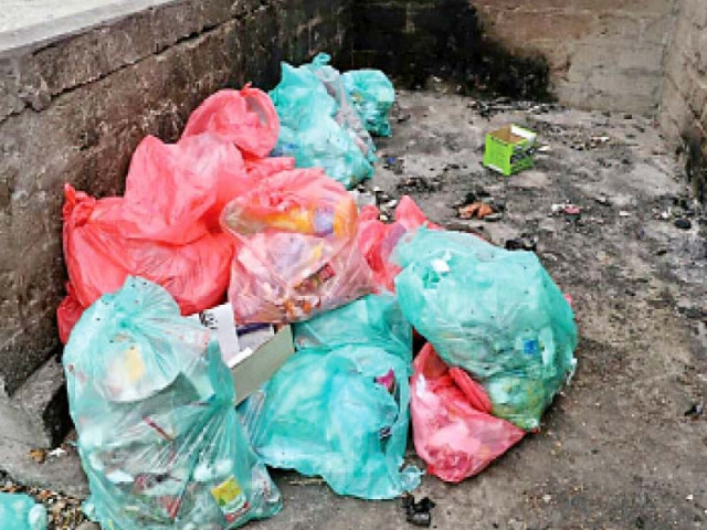 hospital waste lying in the open photo shabbir mir express file hospital waste lying in the open photo shabbir mir express file