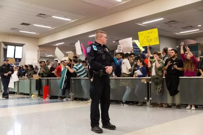 police maintain walkways as people gather to protest against the travel ban imposed by u s president donald trump 039 s executive order at dallas fort worth international airport in dallas texas u s january 28 2017 photo reuters police maintain walkways as people gather to protest against the travel ban imposed by u s president donald trump 039 s executive order at dallas fort worth international airport in dallas texas u s january 28 2017 photo reuters