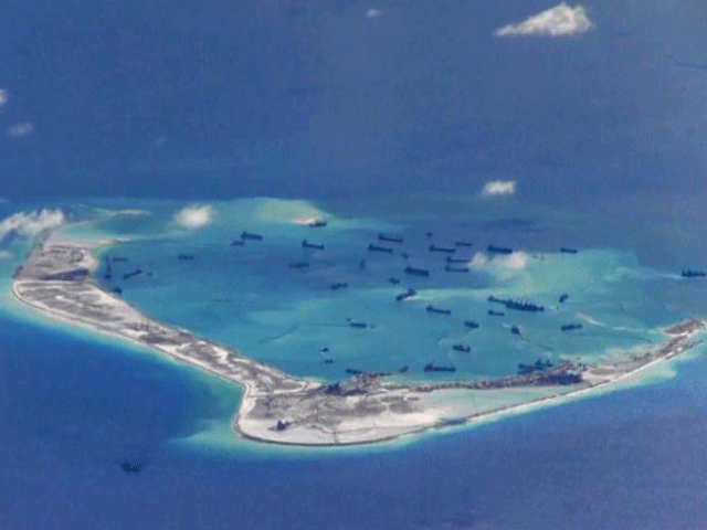 chinese dredging vessels are purportedly seen in the waters around mischief reef in the disputed spratly islands in the south china sea in this still image from video taken by a p 8a poseidon surveillance aircraft provided by the united states navy may 2 photo reuters