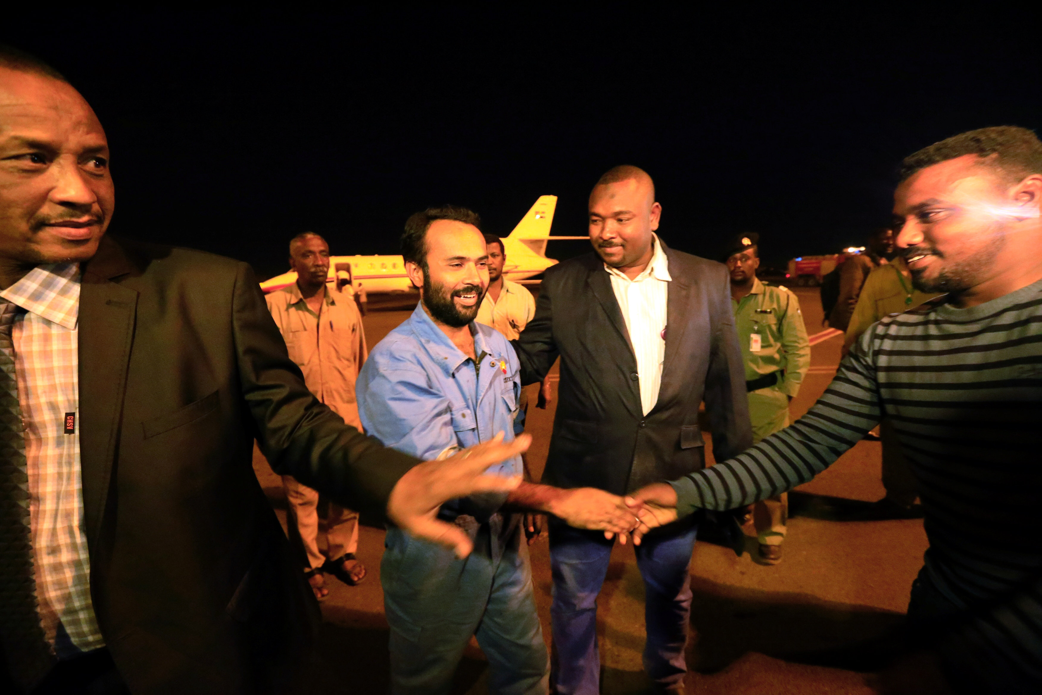 ayaz jamali who was kidnapped by rebels in south sudan was welcomed as he arrives after being release at khartoum airport photo reuters