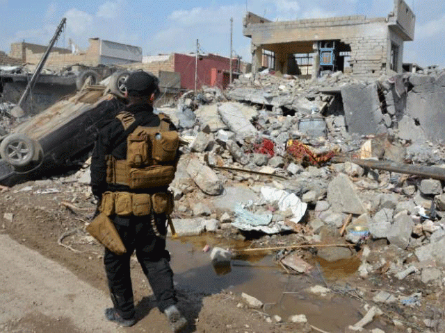 a member of the counter terrorism service cts walks at the site after an air strike attack against islamic state triggered a massive explosion in mosul iraq march 29 2017 photo reuters a member of the counter terrorism service cts walks at the site after an air strike attack against islamic state triggered a massive explosion in mosul iraq march 29 2017 photo reuters