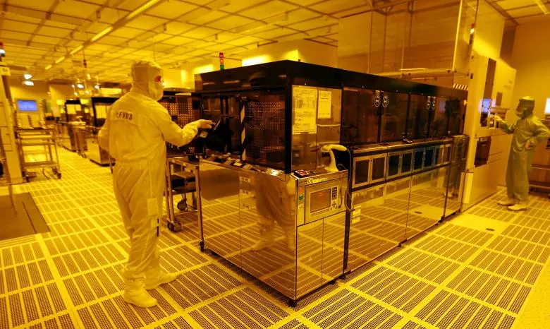 an employee is pictured inside a clean room of german semiconductor manufacturer infineon in regensburg february 12 2013 photo reuters an employee is pictured inside a clean room of german semiconductor manufacturer infineon in regensburg february 12 2013 photo reuters