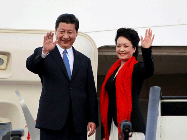 chinese president xi jinping l and first lady peng liyuan bid farewell as they board their plane to depart from the julius nyerere international airport in dar es salaam tanzania march 25 2013 photo reuters