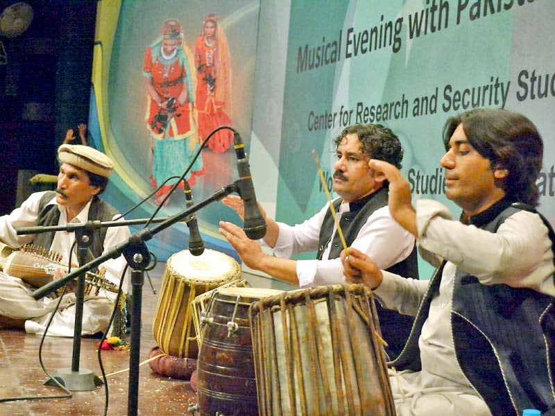 pakistani and afghan artistes perform at a musical event held at the pnca photo online