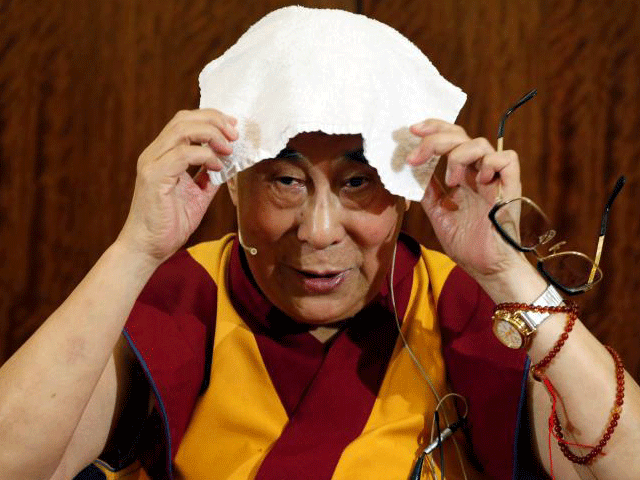 tibet 039 s exiled spiritual leader the dalai lama puts a towel on his head during a news conference in paris france september 13 2016 photo reuters