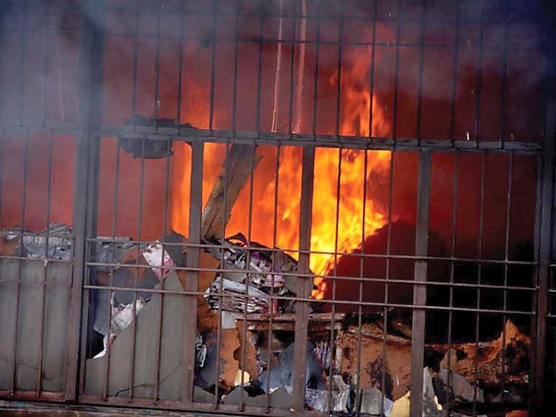 goods worth millions of rupees were gutted in saturday s inferno photo abid nawaz