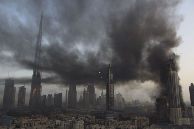 smoke rises from a fire at a construction site next to dubai mall in dubai united arab emirates sunday april 2 2017 photo afp smoke rises from a fire at a construction site next to dubai mall in dubai united arab emirates sunday april 2 2017 photo afp