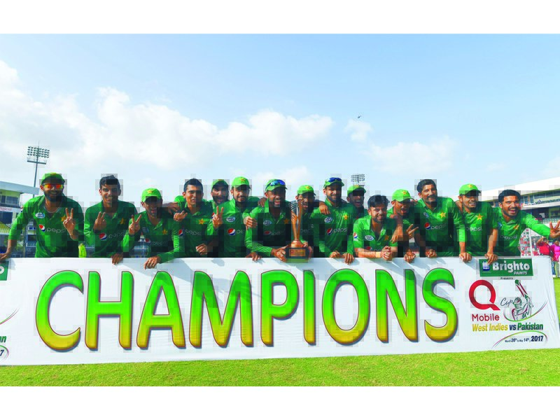 pakistan team pose with their winning trophy at the end of the final of the four t20i match series between west indies and pakistan at the queen s park oval in port of spain trinidad photo afp