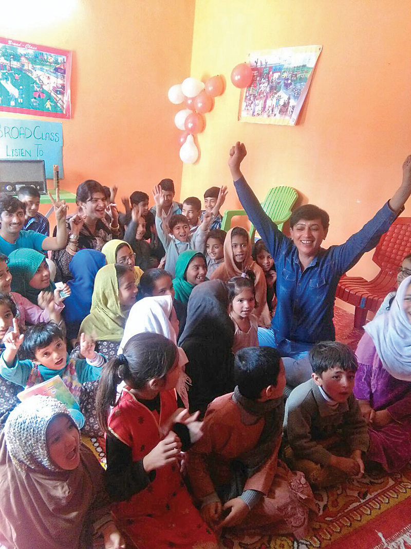 a cheerful group of students being taught by a transgender teacher photo express