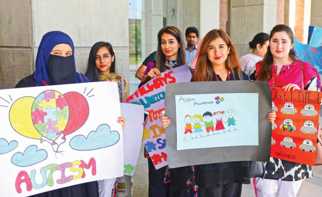 a large number of people including parents and professionals participated in a walk to raise awareness about autism photo express