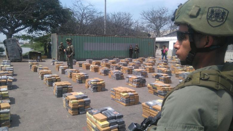 soldiers stand guard next to packages containing cocaine after colombian police seized more than six tonnes of the drug in barranquilla colombia april 2 2017 photo reuters