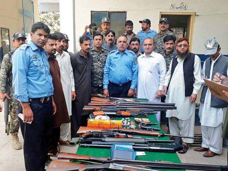 police officials show licensed and unlicensed weapons seized from people during a search operation in bhara kahu photo nni