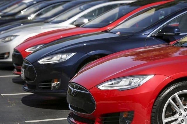 the company delivered 25 000 of its high tech vehicles in the january march period photo reuters the company delivered 25 000 of its high tech vehicles in the january march period photo reuters